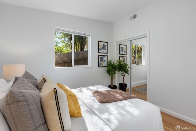 bedroom with a closet and light wood-type flooring