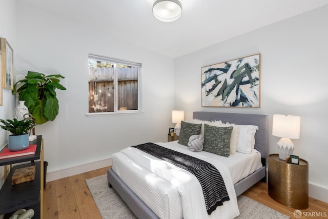 bedroom with light hardwood / wood-style floors