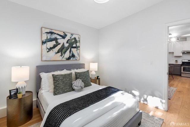 bedroom with light hardwood / wood-style flooring