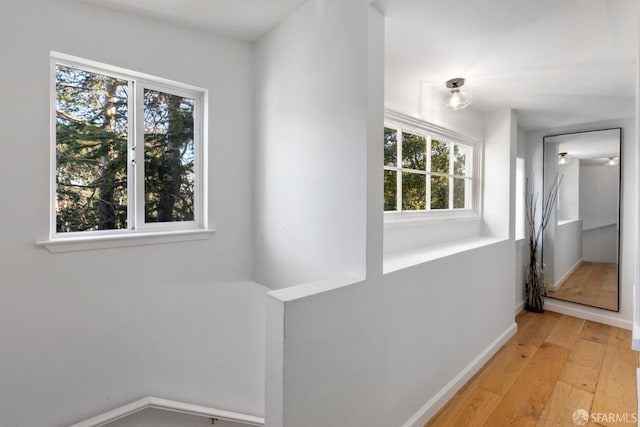 hall with light hardwood / wood-style floors