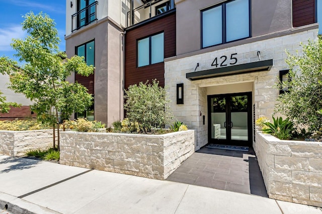425 First St Unit 31, Los Altos, CA 94022 - property entrance featuring french doors, stone siding, and stucco siding