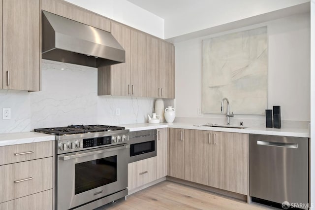 425 First St Unit 31, Los Altos, CA 94022 - kitchen featuring stainless steel appliances, wall chimney range hood, light brown cabinetry, and modern cabinets