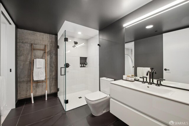 960 Market St Unit 514, San Francisco, CA 94102 - bathroom featuring toilet, vanity, a stall shower, and tile patterned flooring