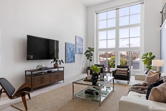 229 8th St Unit 3, San Francisco, CA 94103 - living room with a towering ceiling, healthy amount of natural light, and wood finished floors