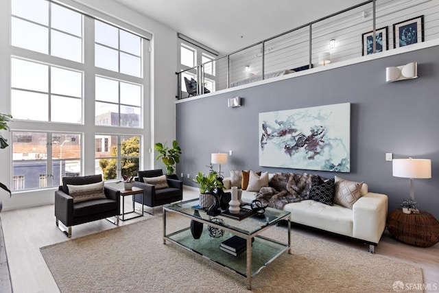 229 8th St Unit 3, San Francisco, CA 94103 - living area featuring a towering ceiling and wood finished floors