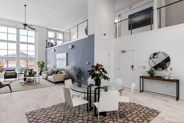 229 8th St Unit 3, San Francisco, CA 94103 - dining area featuring a high ceiling, wood finished floors, and ceiling fan