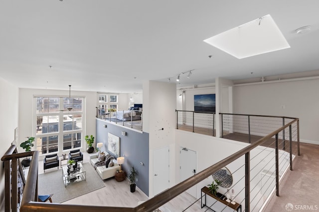 229 8th St Unit 3, San Francisco, CA 94103 - hall with an upstairs landing, track lighting, and a skylight
