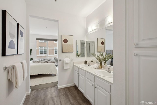 bathroom featuring vanity and hardwood / wood-style floors