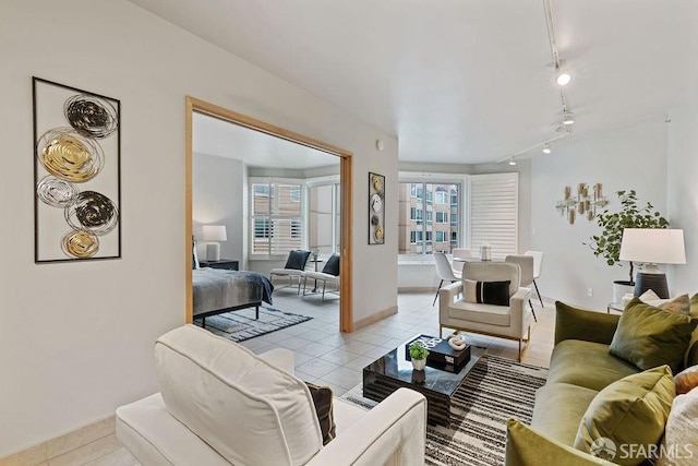 tiled living room featuring rail lighting