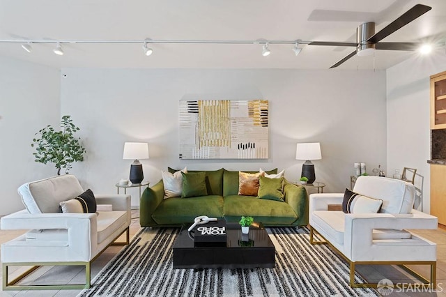 living room with ceiling fan and track lighting