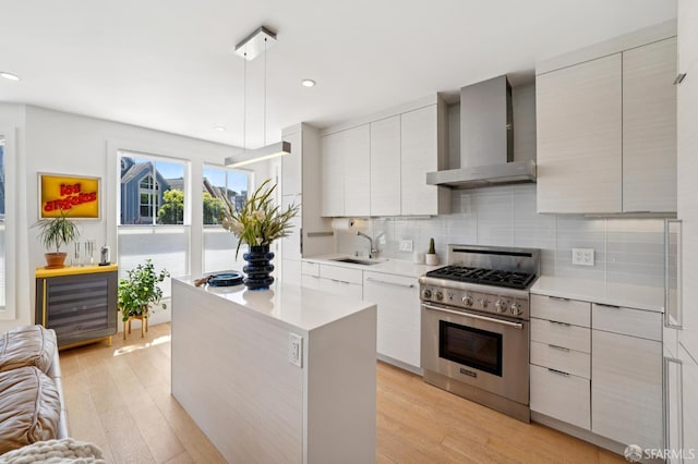 392 Corbett Ave, San Francisco, CA 94114 - kitchen with wall chimney range hood, high end range, modern cabinets, beverage cooler, and recessed lighting