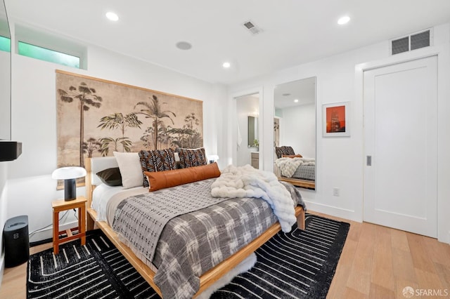 392 Corbett Ave, San Francisco, CA 94114 - bedroom with light wood-style flooring and recessed lighting