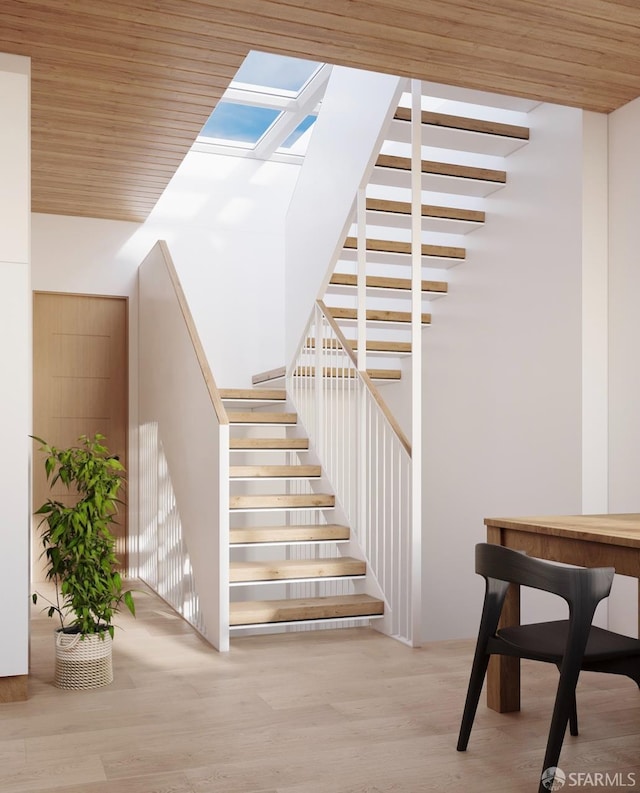 28-30 Sonoma St, San Francisco, CA 94133 - stairs with a skylight, wood finished floors, wood ceiling, and a high ceiling