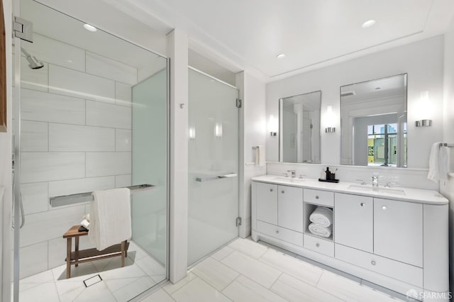 bathroom with vanity and a shower with shower door