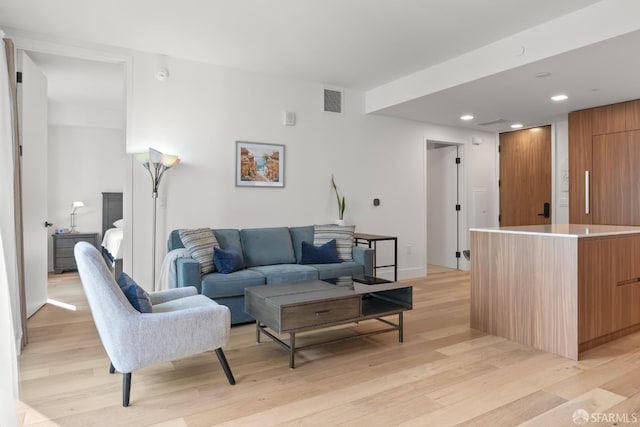 living room with light hardwood / wood-style floors