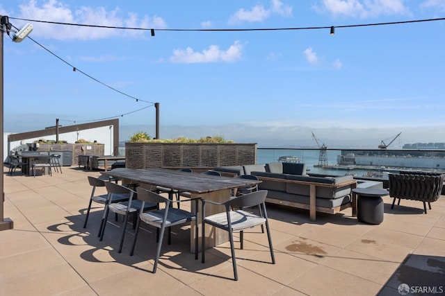 view of patio / terrace featuring an outdoor hangout area and a water view