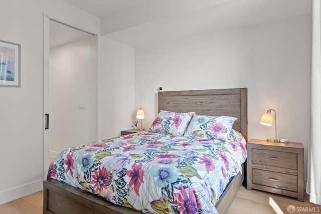 bedroom with light wood-type flooring