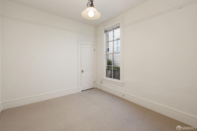 unfurnished room with light colored carpet