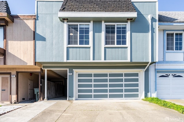 townhome / multi-family property featuring a garage