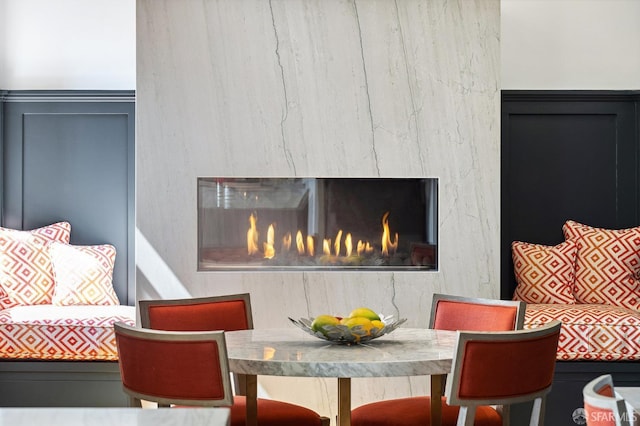 dining room with a premium fireplace