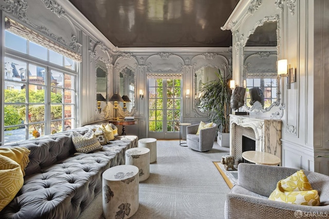 sunroom / solarium with a fireplace with flush hearth