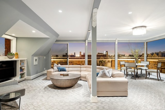 living area featuring recessed lighting and baseboards