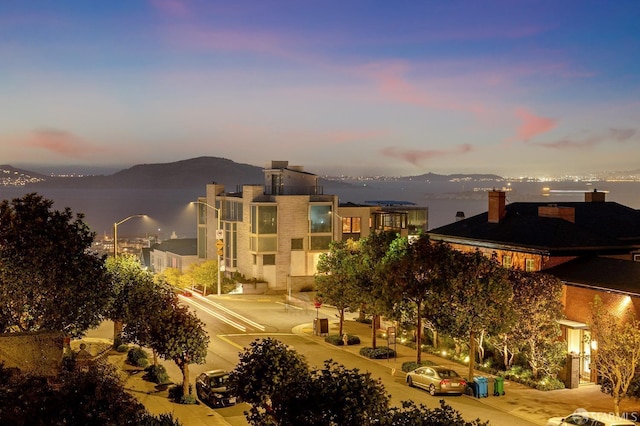 property's view of city with a mountain view