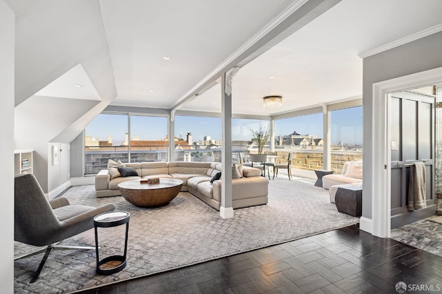 living area with recessed lighting, a view of city, crown molding, and baseboards