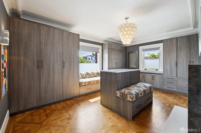 living area with plenty of natural light and crown molding