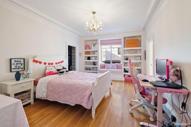 bedroom with light wood-style flooring, a chandelier, and crown molding