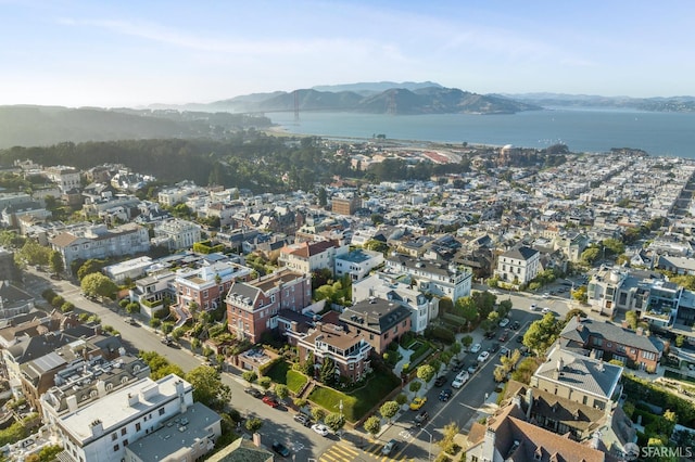 bird's eye view with a water and mountain view