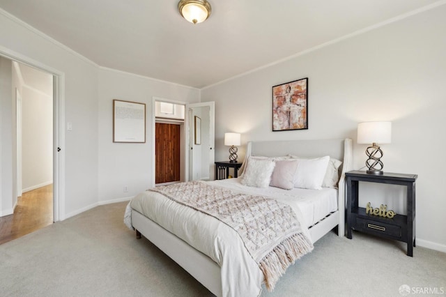 bedroom featuring light carpet and baseboards