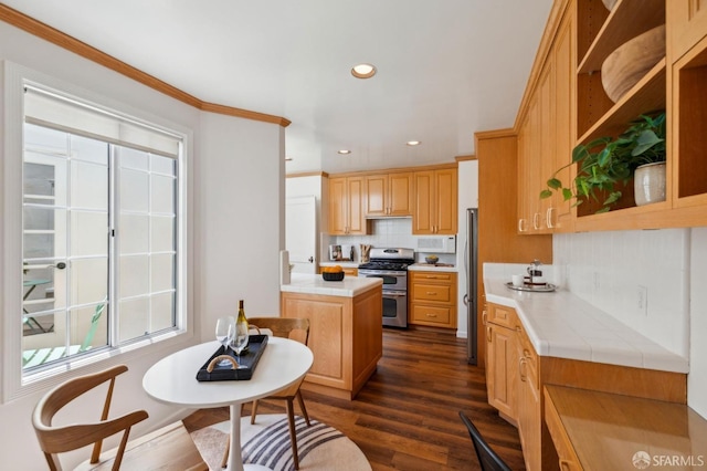 kitchen with stainless steel appliances, decorative backsplash, tile counters, dark wood-style flooring, and open shelves