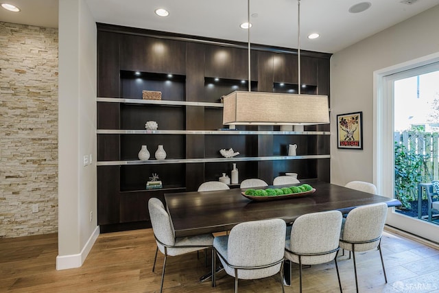 dining space with recessed lighting, visible vents, baseboards, and wood finished floors