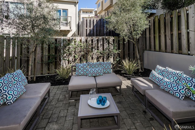 view of patio with a fenced backyard and outdoor lounge area