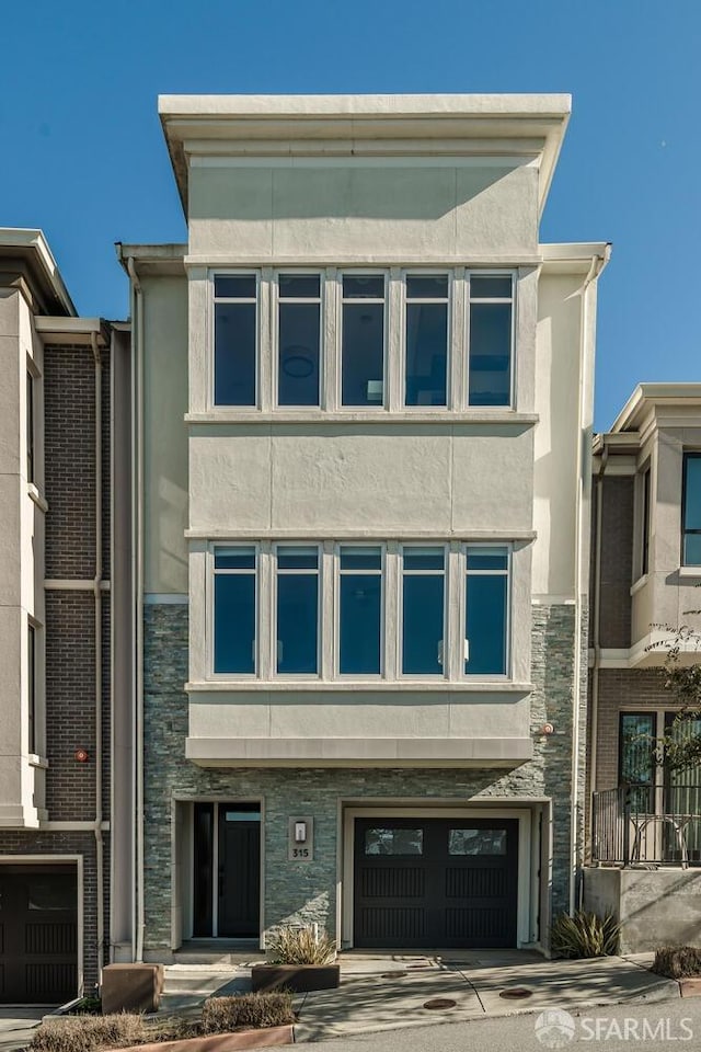 view of building exterior with an attached garage