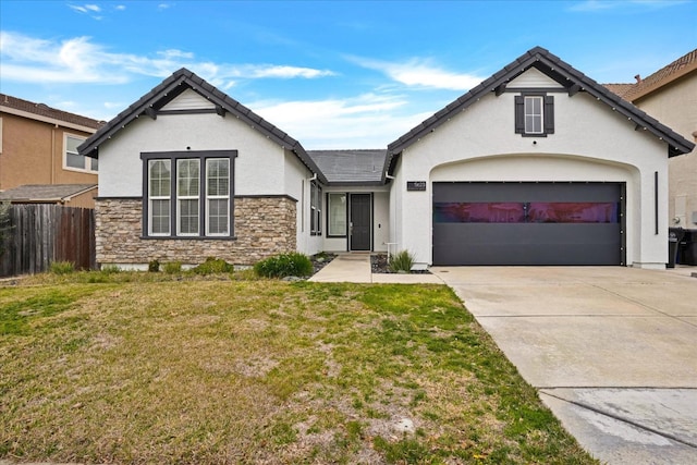 view of front of property featuring a garage and a front yard