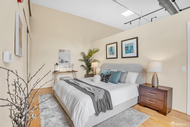 bedroom with light hardwood / wood-style floors