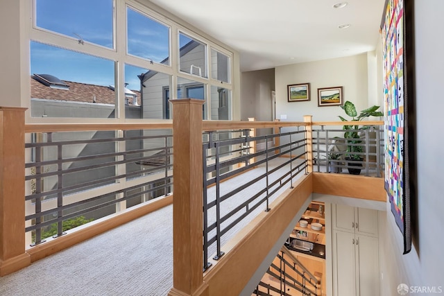corridor featuring an upstairs landing