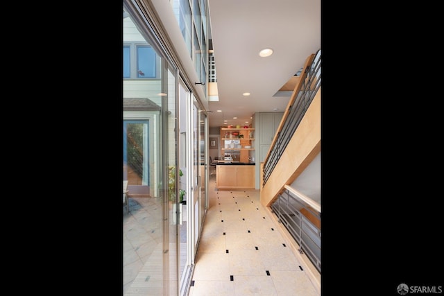 corridor with recessed lighting and light floors
