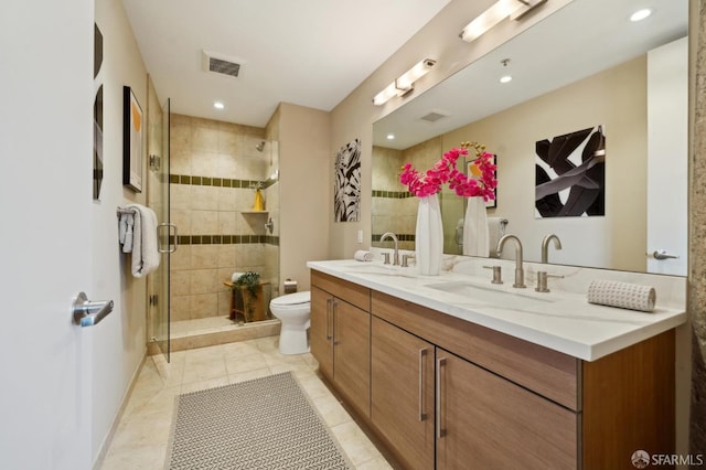 1 S Park St Unit 308, San Francisco, CA 94107 - full bathroom featuring double vanity, a shower stall, toilet, tile patterned floors, and recessed lighting
