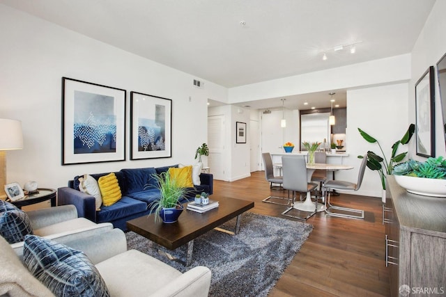 2655 Bush St Unit 603, San Francisco, CA 94115 - living area with baseboards, wood finished floors, and visible vents