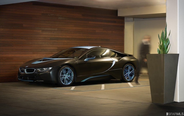 garage featuring wood walls