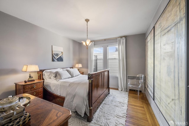 bedroom with hardwood / wood-style flooring