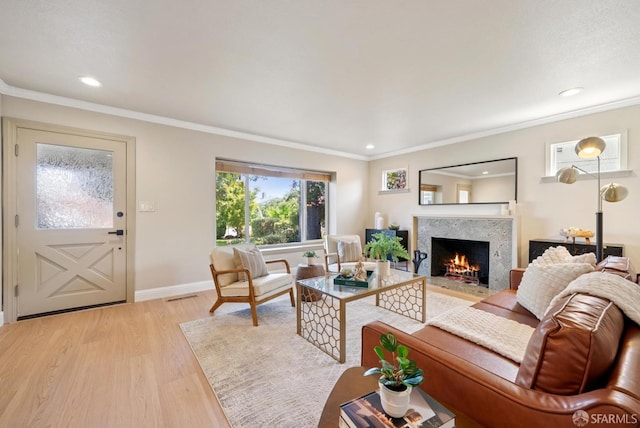 4649 Theta St, Fremont, CA 94536 - living room with light wood-type flooring, a high end fireplace, recessed lighting, and crown molding