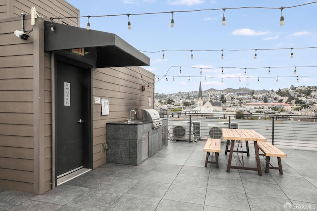 1188 Valencia St Unit 403, San Francisco, CA 94110 - view of patio / terrace with exterior kitchen, outdoor dining space, and a mountain view