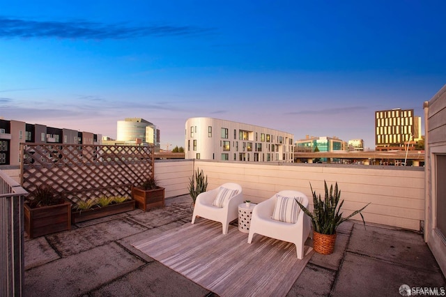 view of patio terrace at dusk