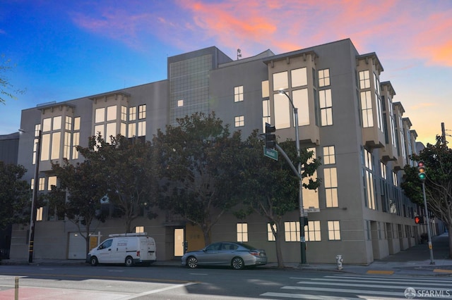 view of outdoor building at dusk