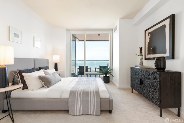 401 Harrison St Unit 25F, San Francisco, CA 94105 - carpeted bedroom featuring access to outside, floor to ceiling windows, and baseboards