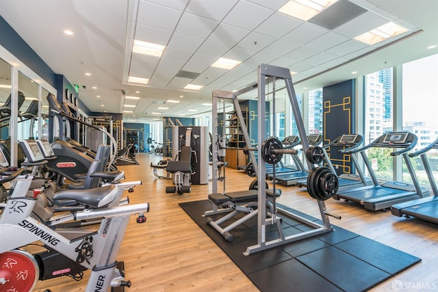 401 Harrison St Unit 25F, San Francisco, CA 94105 - exercise room with a wall of windows and wood finished floors